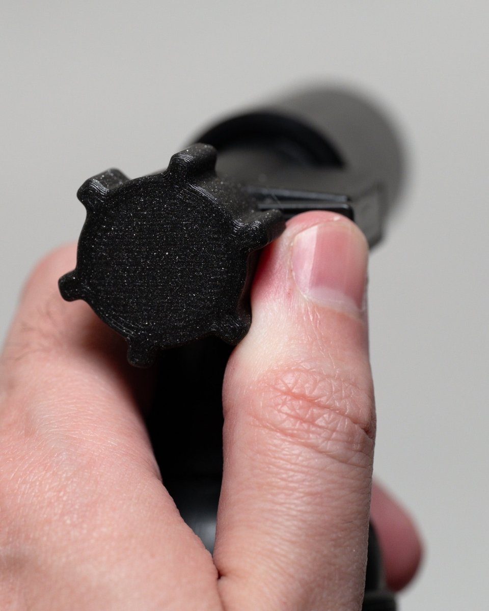 Close up of  Blazer big shot gt 8000 knob with hand for scale.