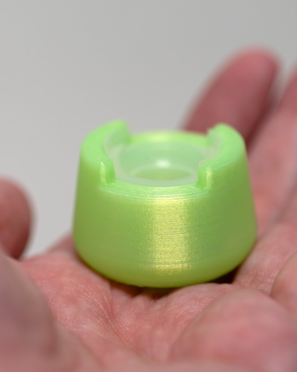 Front view of bubble cap holder lite with included silicone insert: color ooze green.