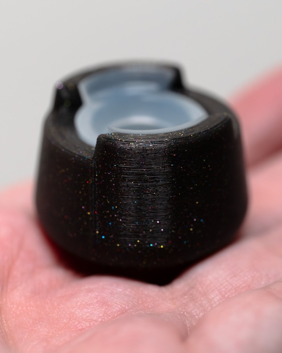 Side view of bubble cap holder lite with included silicone insert: color Galaxy Black.