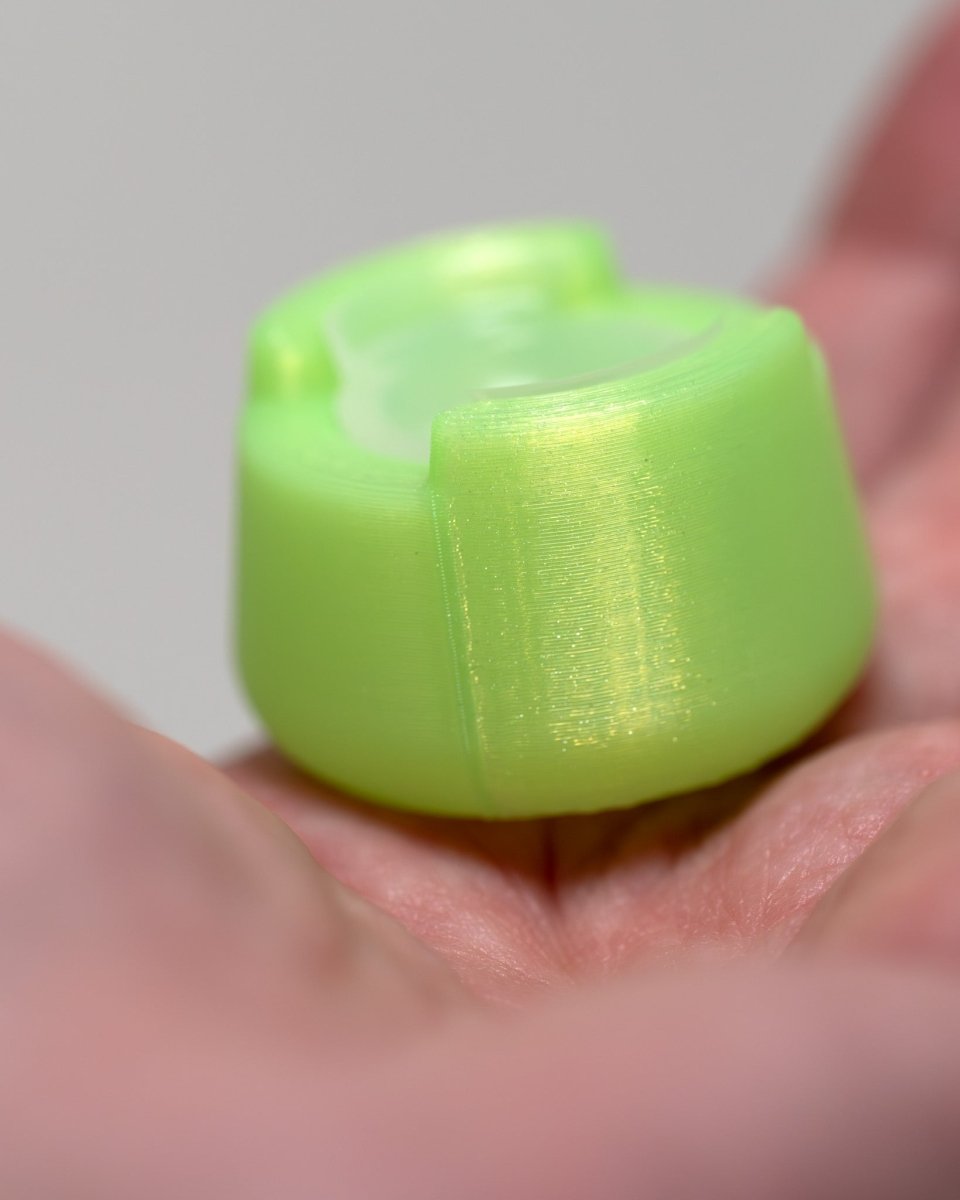 Side view of bubble cap holder lite with included silicone insert: color ooze green.