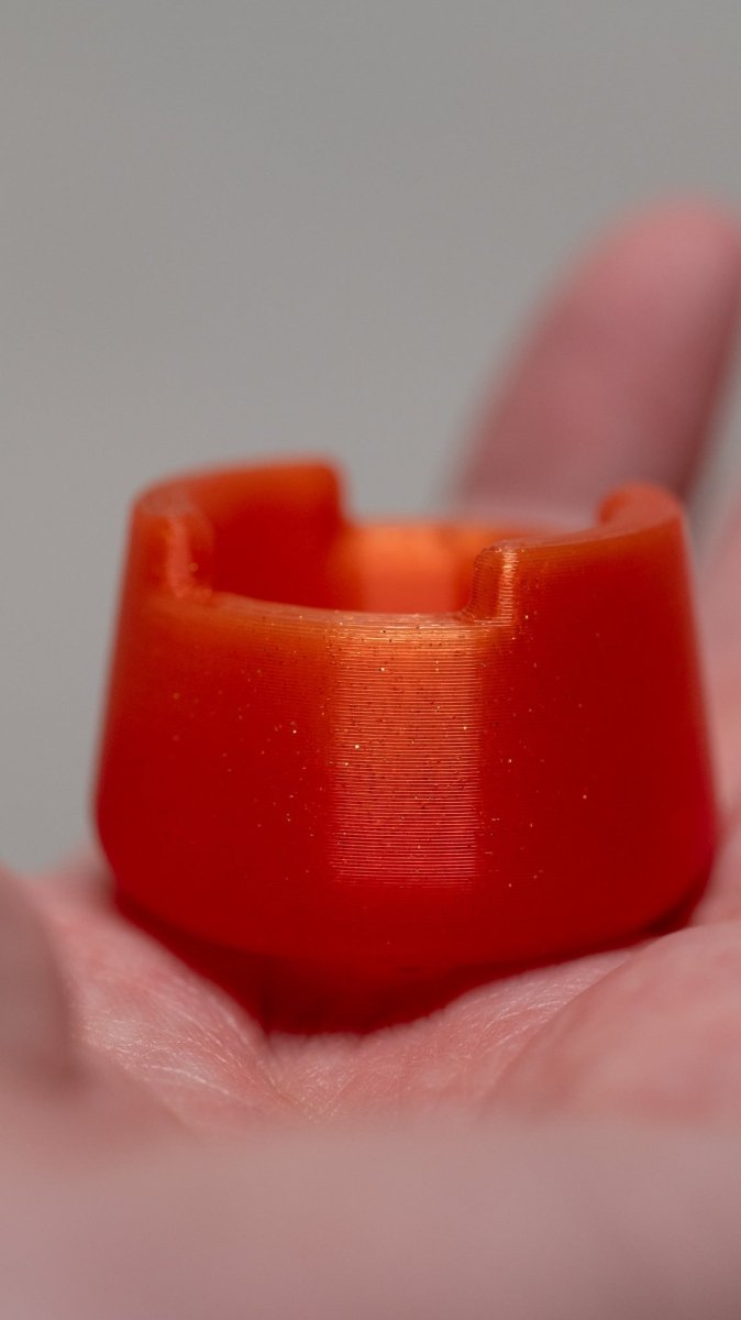 close up of sunrise orange bubble cap holder 