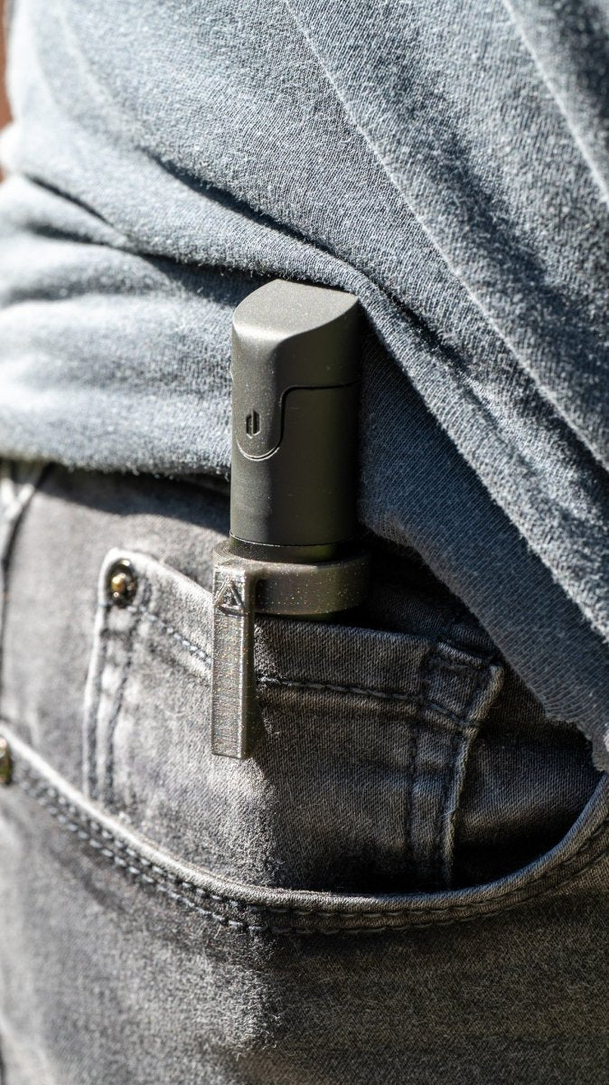 Galaxy black Puffco Pivot pocket clip in coin pocket.